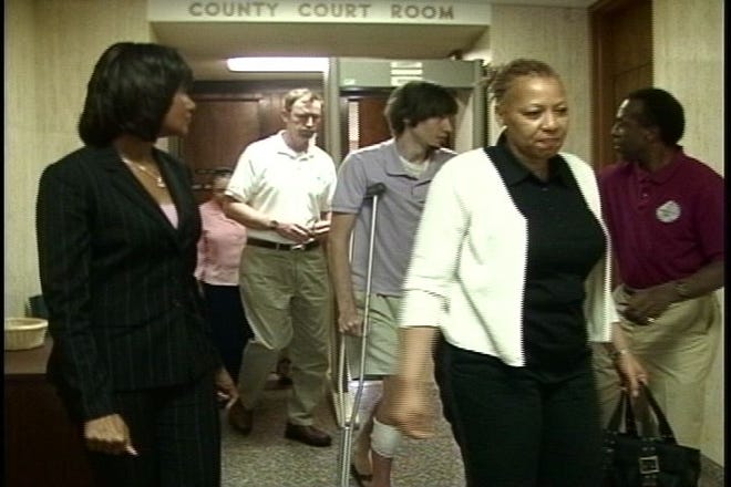 Victims of the shooting leave the courtroom after testifying.