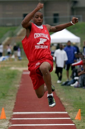Central High School’s Chris Hedgemon competes in the triple jump Saturday at the Class 5A, Section 3 track meet at Northridge High School. Northridge won both the boys and girls titles.