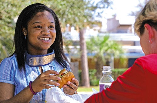 Courtney Wade, an eighth-grader at Howard Bishop Middle School, enjoys lunch with Linda Galloway, her mentor in the Take Stock in Children program, which is designed to stop the cycle of poverty by providing college tuition scholarships to low-income children. Alachua County students enter the program during seventh grade. Volunteer mentors are always needed.