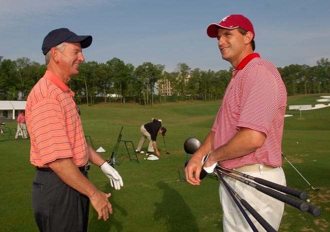 Auburn head football coach Tommy Tuberville, left, and Alabama coach Mike Shula talk before playing in the Regions Charity Classic Pro-Am at Ross Bridge Resort in Hoover on Thursday.