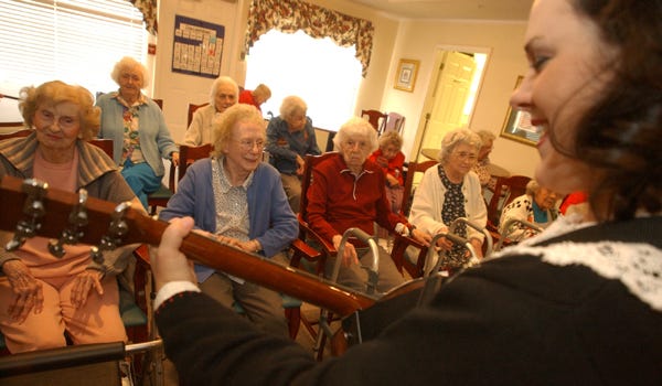 Shawna Smith plays her introduction song Friday at Martinview Assisted Living in Northport.
