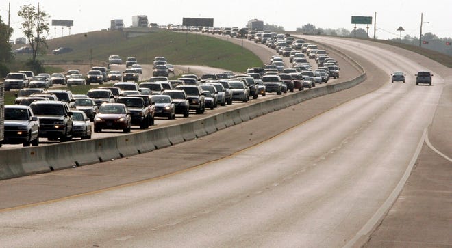 Cars are bumper to bumper on Interstate 45 in Fairfield, Texas, in September 2005 as thousands of people evacuate the Texas coast as Hurricane Rita approached. Experts say another major Gulf Coast storm could send prices much higher than $3 per gallon.