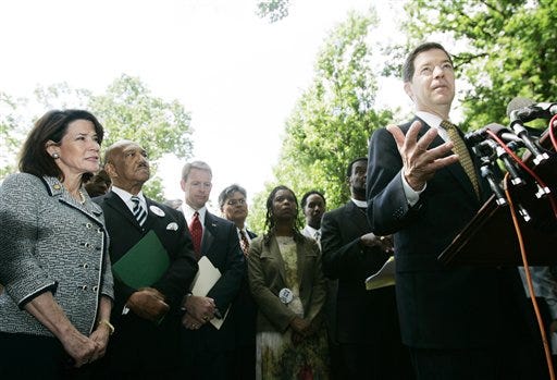 Sen. Sam Brownback, R-Kan., right, with, from left, Rep. Katherine Harris, R-Fla., Pastor Rev. William Owens Founder and President of the Coalition of African American , and Family Research Council President Tony Perkins, speaks in a news conference on Capitol Hill to support the Marriage Protection Amendment, Tuesday.