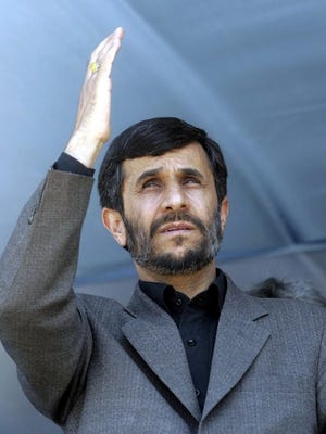 Iranian President Mahmoud Ahmadinejad waves to the crowd during a public gathering in his visit to the city of Qazvin, Iran, on Thursday.