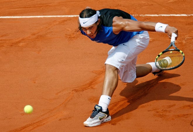 Rafael Nadal returns the ball to Roger Federer during the French Open men's final match on Sunday in Paris.