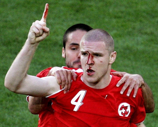 Switzerland's Philippe Senderos, right, celebrates after scoring with teamamte Ricardo Cabanas during the Switzerland v. South Korea 2006 World Cup Group G soccer match at the World Cup stadium, Friday, June 23, 2006, in Hanover, Germany.
