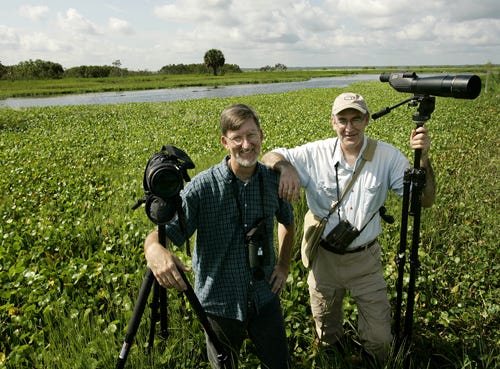 Birders Rex Rowan, left, and Mike Manetz pose together on the La Chua Trail in Paynes Prairie Preserve State Park Thursday, June 15, 2006. Rowan and Manetz recently released a new book titled, "A Birdwatcher's Guide to Alachua County, Florida."