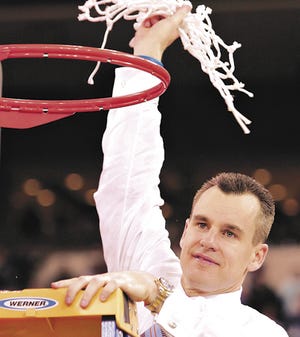 Gator head coach Billy Donovan holds up the net after the University of Florida Gators 73-57 win against the UCLA Bruins Monday, April 3, 2006 at the RCA Dome in Indianapolis, Ind. to capture their first NCAA Championship Title.