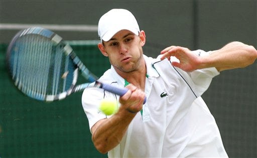 Andy Roddick of the United States returns a shot from Janko Tipsarevic of Serbia, during their Men's Singles, first round match on the Number One Court at Wimbledon, Wednesday June 28, 2006.