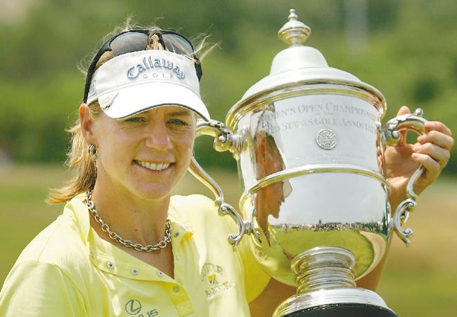 Annika Sorenstam, of Sweden, holds her trophy at the womens U.S. Open golf tournament after winning the event following a playoff round against Pat Hurst, in Newport, Rhode Island, Monday, July 3, 2006.