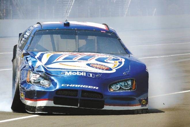The car of NASCAR driver Kurt Busch comes off the wall in turn 1 after a wreck during practice for the Allstate 400 at the Brickyard auto race at the Indianapolis Motor Speedway in Indianapolis, Saturday, Aug. 5, 2006. The Brickyard 400 will take place Sunday.