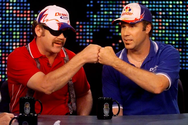 Will Ferrell, right, and John C. Reilly demonstrate their "shake and bake" handshake while being interviewed by talk show host Larry King on July 27.
