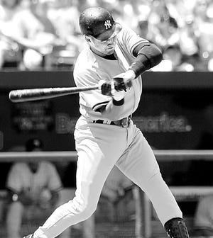 New York Yankees' Derek Jeter swings at his first-inning home run ball in their baseball game against the Baltimore Orioles, Sunday, Aug. 6, 2006, in Baltimore.(AP Photo/Gail Burton