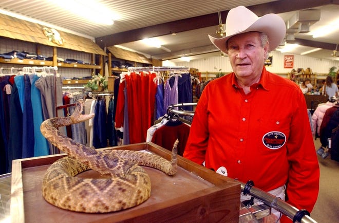 Bill Pate stands inside Pate’s Western Image on Lurleen Wallace Boulevard South. The Western wear store is closing, and even the stuffed rattlesnake inside is for sale. Pate has run a business the the location since the 1950s. Pate sits in a car outside his store, below.