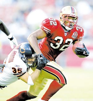 San Francisco 49ers running back Kevan Barlow (32) is tackled by Chicago Bears' Todd Johnson (35) during the first half of an NFL preseason football game Friday, Aug. 11, 2006, in San Francisco.