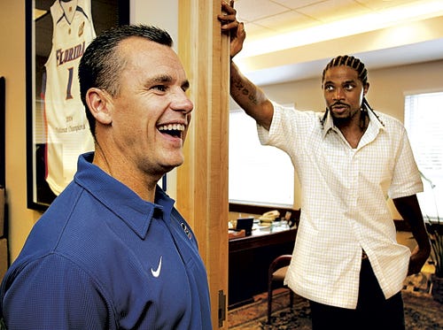 Florida Basketball Head Coach Billy Donovan laughs outside his office during a visit with former player Udonis Haslem of the NBA World Champions Miami Heat Friday, August 25, 2006.