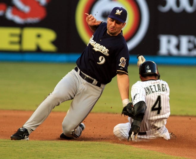 Florida's Alfredo Amezaga steals second base as Milwaukee second baseman Tony Graffanino attempts the tag during the first inning.