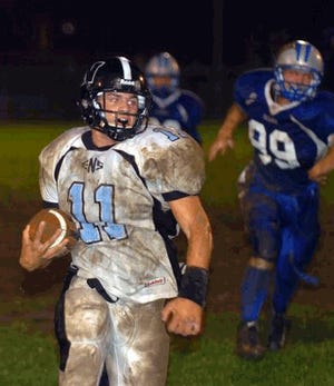 East Stroudsburg North's Jon Clouse (11) off to the races after faking a punt and running for a first down in the second half of the game against Pleasant Valley.