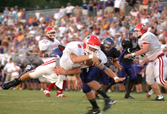 Savannah Christian quarterback Russell DeMasi dives into the end zone for a touchdown during the Raiders' first possession of the game against Calvary Baptist.