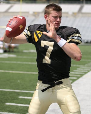 Army quarterback David Pevoto from Colleyville, TX goes through his throwing motion for photos on media day at West Point Military Academy.

for the Times Heerald-Record/ROBERT LEIFHEIT