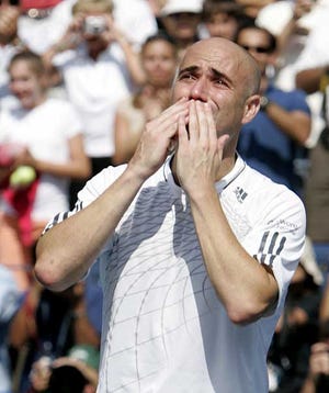 Andre Agassi acknowledges the crowd after his loss to Benjamin Becker, of Germany, at the US Open tennis tournament in New York, Sunday.