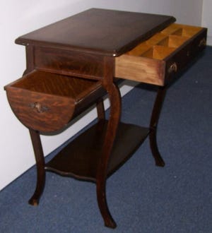 This is likely a mass-manufactured commercial grade sewing table marketed through a catalog, i.e., Sears & Roebuck, circa 1920, with a potential dollar value of $150 to $300.