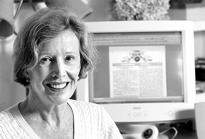 Sally Sonne of Tuxedo Park poses for a photograph with the final issue of the newspaper she published about Tuxedo Park on the computer monitor behind her on Aug. 30, 2006.
