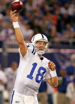The Colts' Peyton Manning fires during the second quarter Sunday night. His team won, 26-21, over the host Giants.