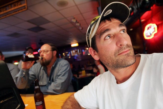 J.D. POOLEY/The Associated Press
Mike Guthrie, 33, watches news of Ford cuts Friday at the Break Room Lounge in Maumee, Ohio, with Max Jobe, 54. Guthrie has worked at Ford for 111Ú2 years; Jobe for more than 30 years. The stamping plant in Maumee will be closed.