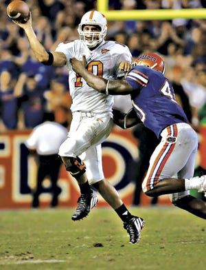 Florida linebacker Brandon Siler puts pressure on Tennessee quarterback Erik Ainge last year.