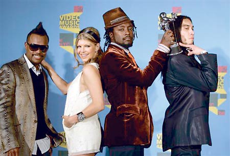 The Black Eyed Peas, consisting of, from left, Allan "apl.de.ap" Pineda Lindo, Stacy "Fergie" Ferguson, William "will.i.am" Adams, and Jaime "Taboo" Gomez, are all over the place. Their songs are used in commercials, they have solo and group albums, are heard in Web casts and have been touring.