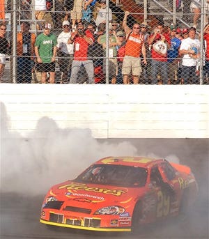 EMILY REILY/The Associated Press
Kevin Harvick does a burn out after winning the Sylvania 300 on Sunday.