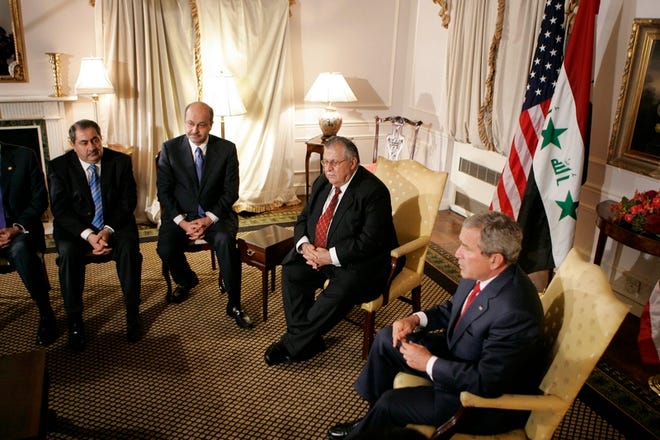 President Bush sits next to Iraqi President Jalal Talabani during bilateral meetings related to the United Nations General Assembly in New York on Tuesday. Other attendees pictured are unidentified.