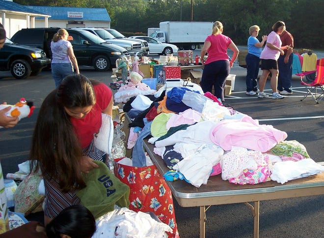 Bargain hunters serached for good deals during the MOPS of Pooler garage sale on Sept. 9.