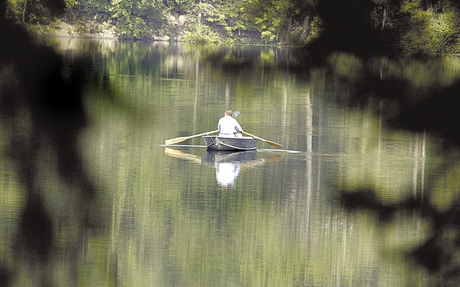 A boater takes advantage of the calm waters of Williams Lake for some solitude and easy fishing at the Lake Williams Resort in Rosendale earlier this month.