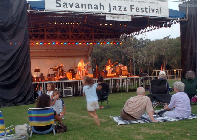 Music fans enjoy the sounds,of the Eric Culberson Blues Band Thursday during the opening night of the Savannah Jazz Festival in Forsyth Park.