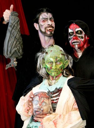 Performers from The Blue Door haunted house are in character and ready to incite fright.