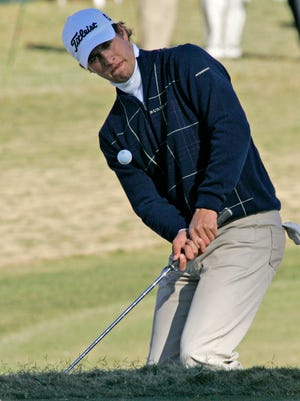 Adam Scott, of Australia, chips to the green on the 12th hole during the second round of the Tour Championship golf tournament in Atlanta, Friday, Nov. 3, 2006. Scott ended the day tied for the lead with Joe Durant at 4 under par. (AP Photo/John Amis)