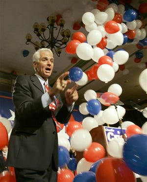 Florida Governor-elect Charlie Crist celebrates with supporters after claiming the Florida gubernatorial race, Tuesday night.