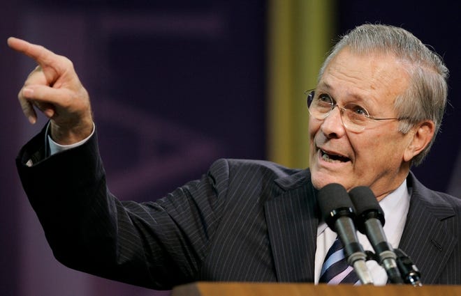 Donald Rumsfeld points to soldiers from Fort Riley during a lecture at Kansas State University on Thursday.