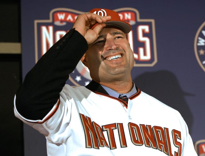 The Washington Nationals hired New York Mets third base coach Manny Acta as manager on Tuesday.