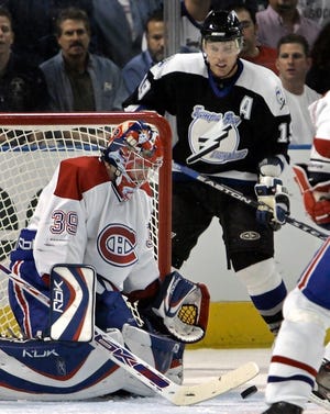 Montreal goaltender Cristobal Huet makes a save on a shot by Tampa Bay's Brad Richards (19) during the first period of Montreal's 3-1 win Wednesday.