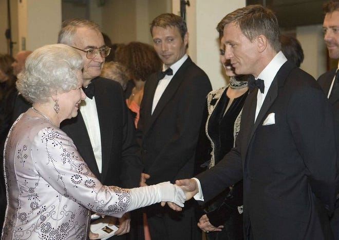 Britain's Queen Elizabeth II, left, meets actor Daniel Craig, the new James Bond, during the world premiere of the latest James Bond movie "Casino Royale" at the Odeon cinema in Leicester Square in London, Tuesday, Nov. 14, 2006.