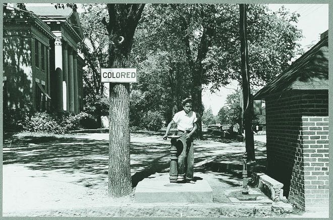 A scene of the segregated South, taken in 1938 at the Halifax County Courthouse in northeastern North Carolina.
Photo by John Vachon/Farm Security Administration