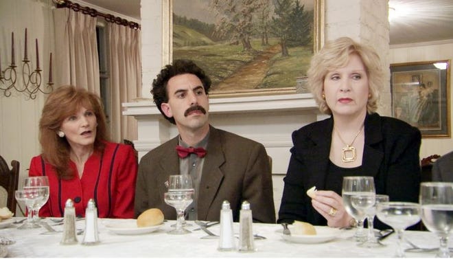 Borat and a few of the dinner guests who are calling into question the validity of the waiver form they all signed to appear in the film.