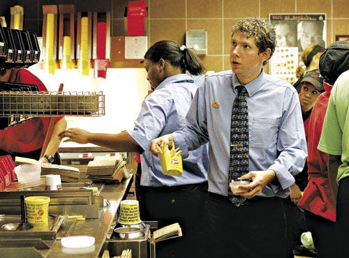 Michael Langieri, general manager of Wendy's located in J. Wayne Reitz Union on the University of Florida campus, moves about filling orders Wednesday, November 15, 2006, during a late lunch rush. Langieri dropped out of college to manage the Wendy's in the Reitz and is already planning for his retirement with the company's 401(k) program.