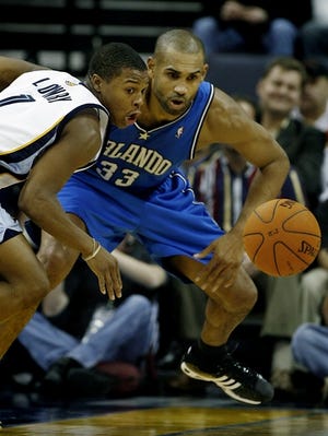 Memphis' Kyle Lowry, left, steals the ball from Orlando's Grant Hill during the third quarter.