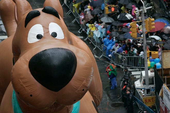 A Scooby Doo balloon floats down Broadway during the Macy's Thanksgiving Day Parade.