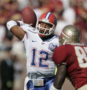 Florida quarterback Chris Leak, left, throws a second quarter pass as Florida State's Lawrence Timmons moves in , Saturday in Tallahassee.