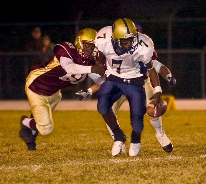 North Marion's Demarrio Sims (61), the county sack leader, created havoc with two quarterback pressures on Eustis' Courtney Keith.